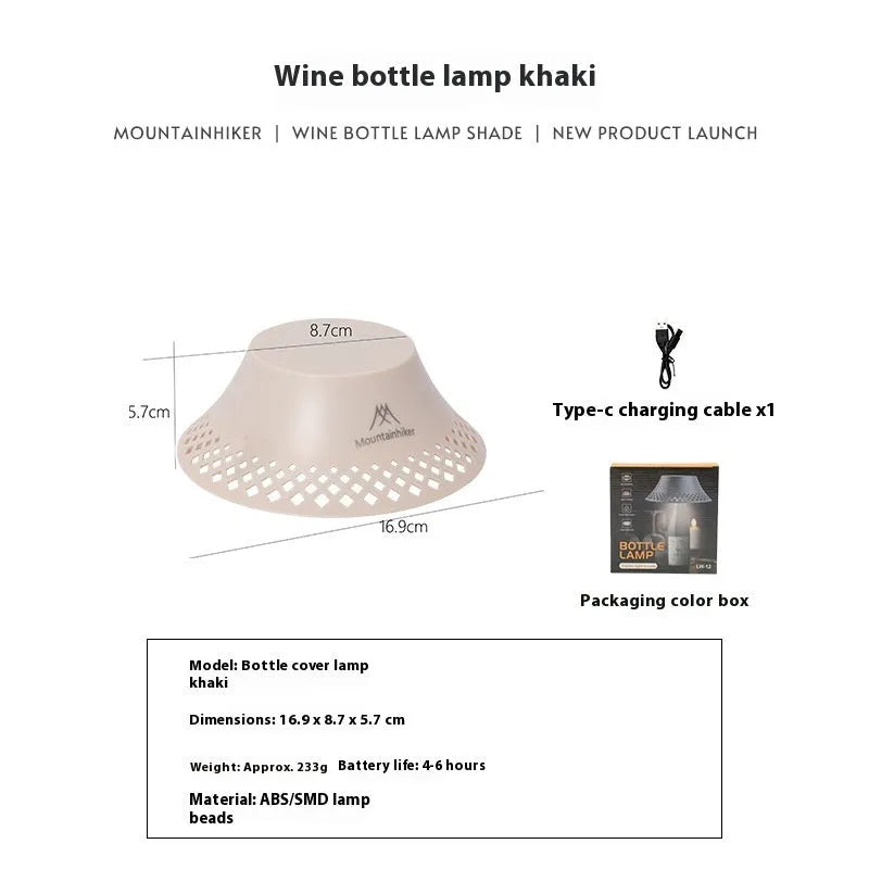 Beige wine bottle camping lantern with USB-C port and gear switch for light modes on wooden table.