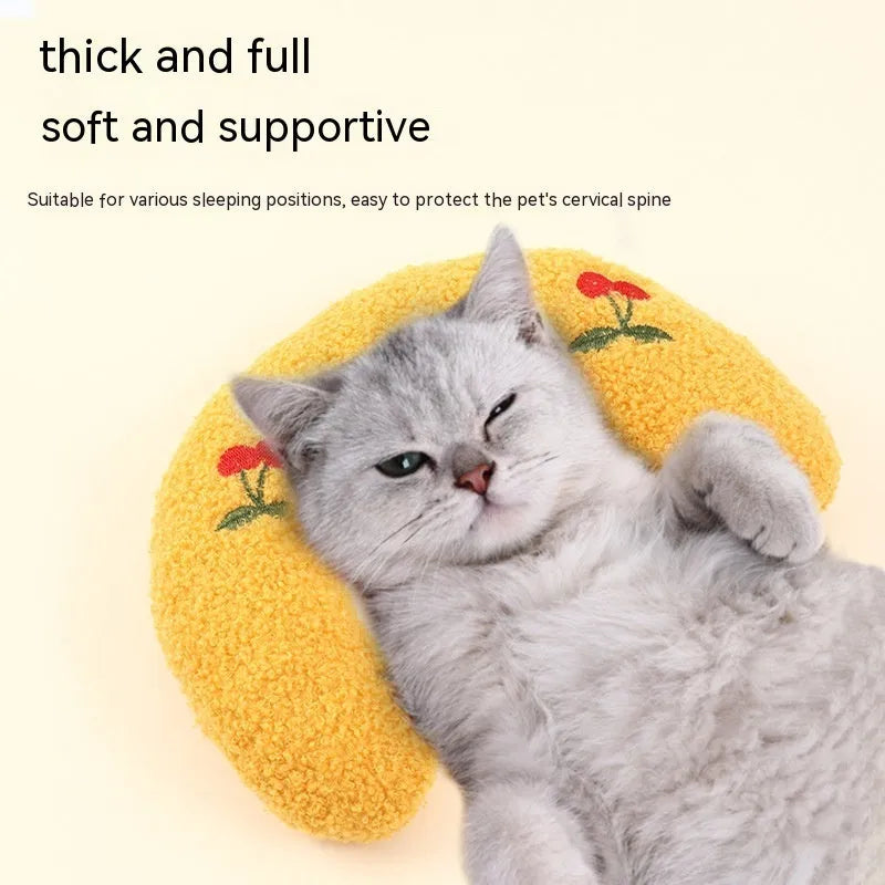 Soft quilted U-shaped cat pillow in blue, 26x18cm, on a clean white background