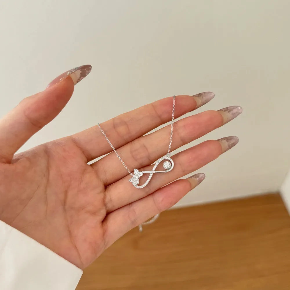 Mobius bow zircon clavicle chain in 925 sterling silver with electroplated gold or platinum finish and butterfly design