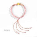 Hand-woven red rope bracelet with crystal centrepiece in Chinese peach blossom design