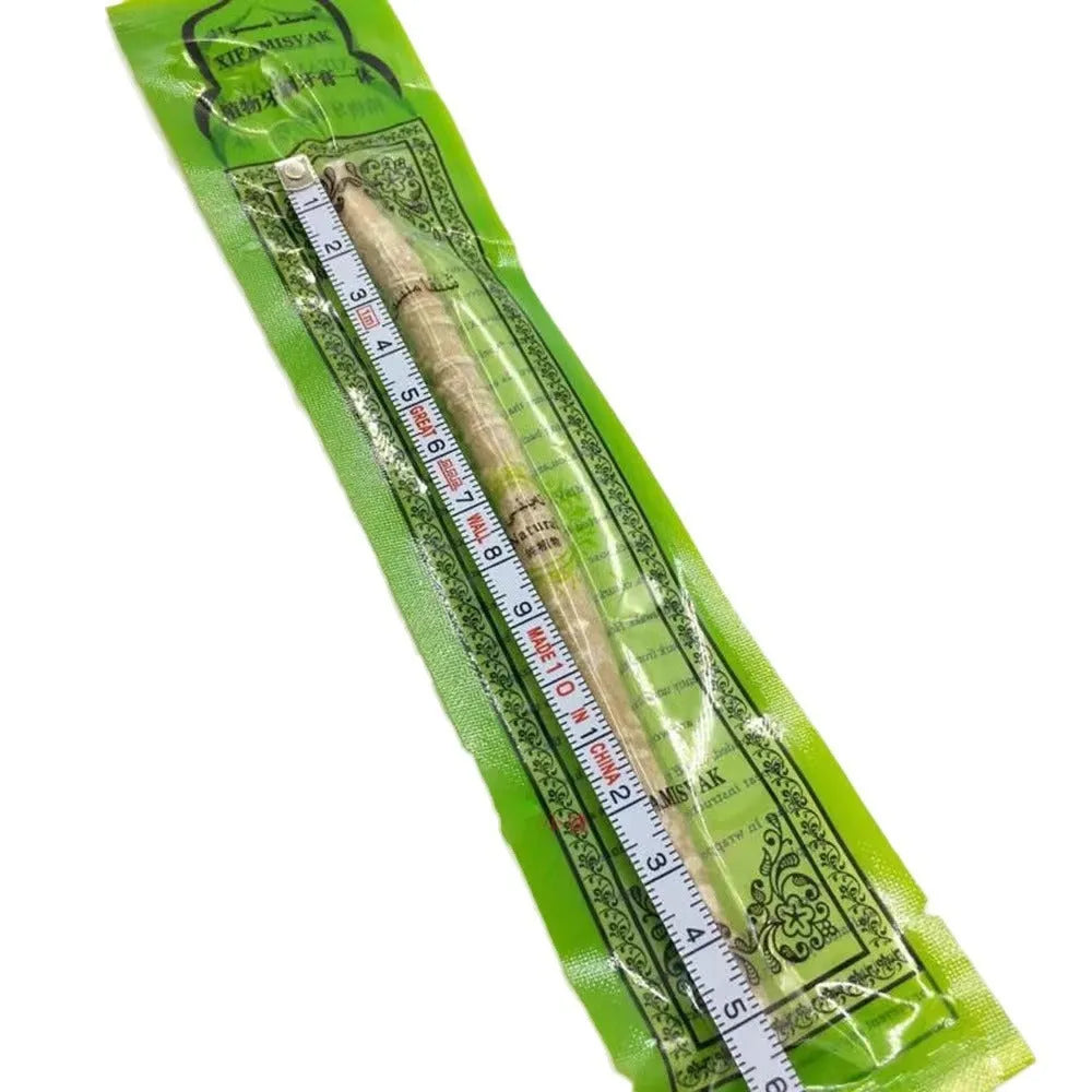 Wooden teeth cleaning stick on bathroom counter for adult oral hygiene
