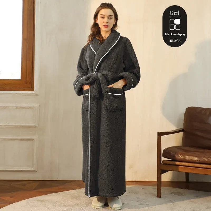 A man and woman wearing matching heavyweight navy blue flannel bathrobes, a couple's winter nightgown set.