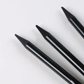 A graphite and carbonised pencil suit on a suction card, showing nine wooden pencils.