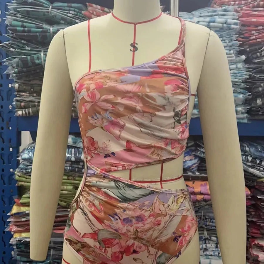 Rose gold patterned women's swimsuit in polyester fabric on mannequin