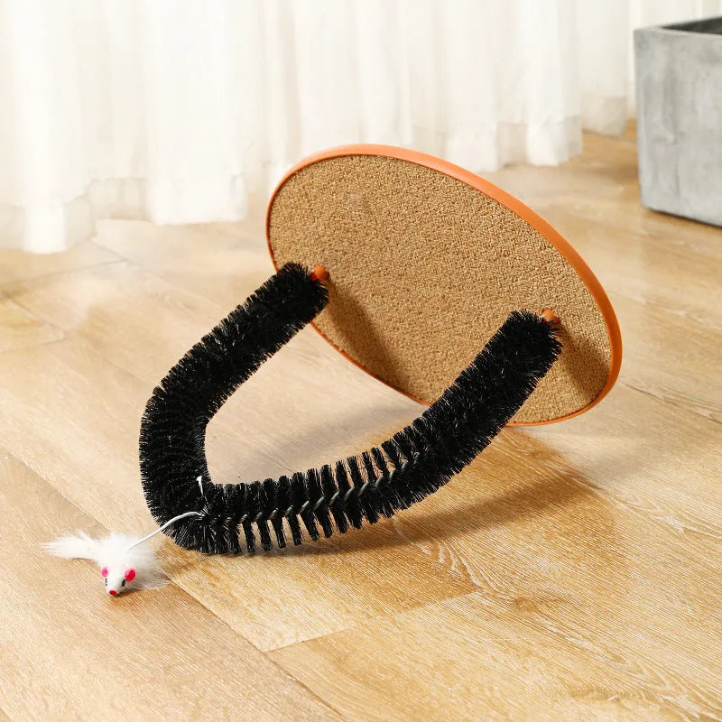 Black plastic arch-shaped cat grooming brush and scratching post with attached mouse toy