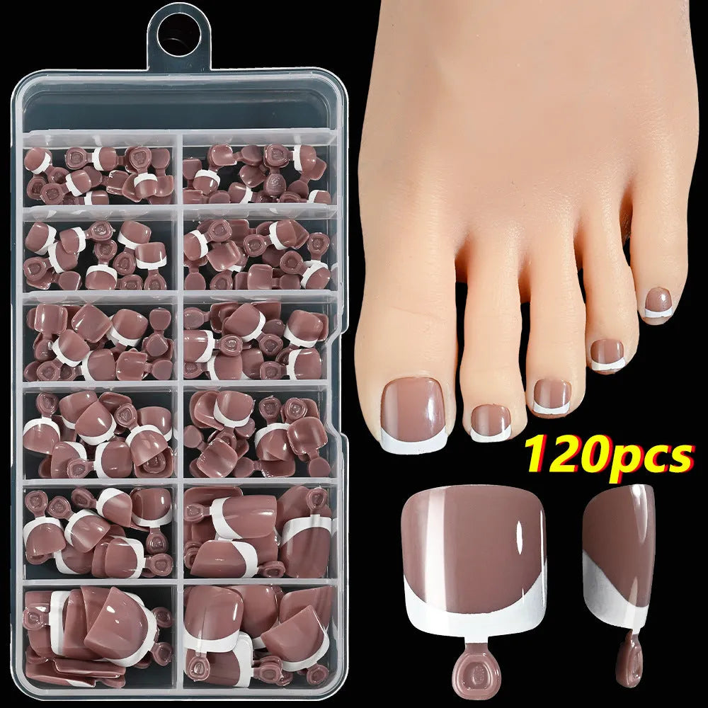 120 piece boxed set of full square short artificial toenails with French white edge design on nude base