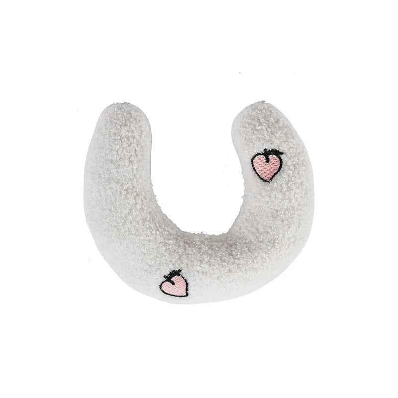 Soft quilted U-shaped cat pillow in blue, 26x18cm, on a clean white background