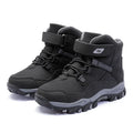 Hobby Bear children's black waterproof Martin boots with velcro buckle on a rubber sole.