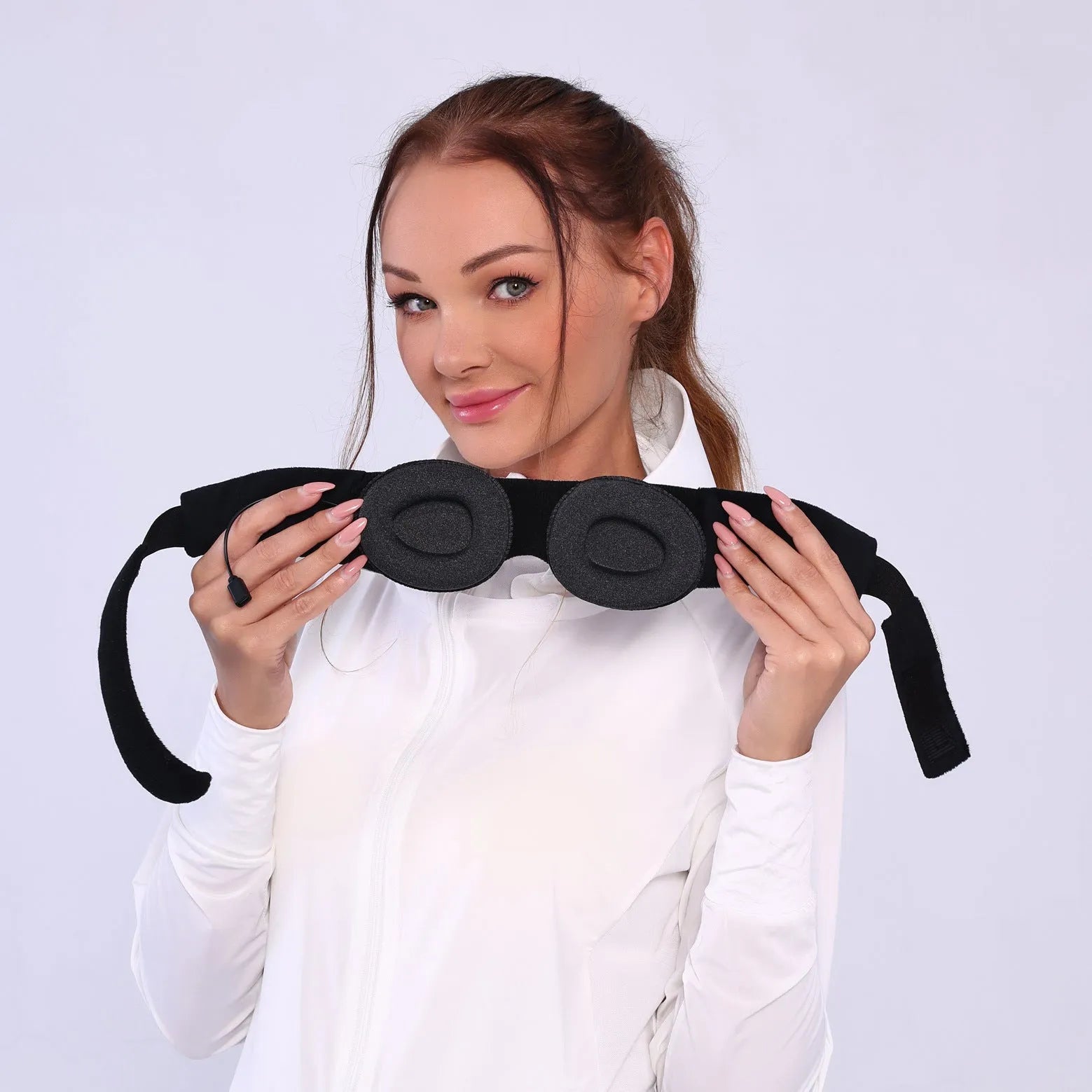 Grey outline Bluetooth sleeping eye mask with long eyelashes design on a polyester fabric.