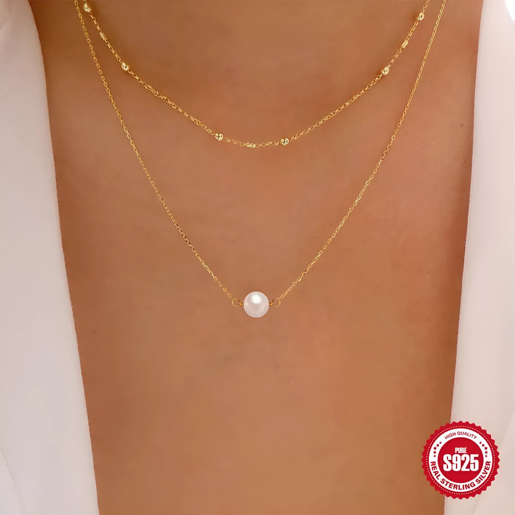 S925 Sterling silver double layer necklace with twin pearls on a ball bead chain, shown in gold and white gold colours.