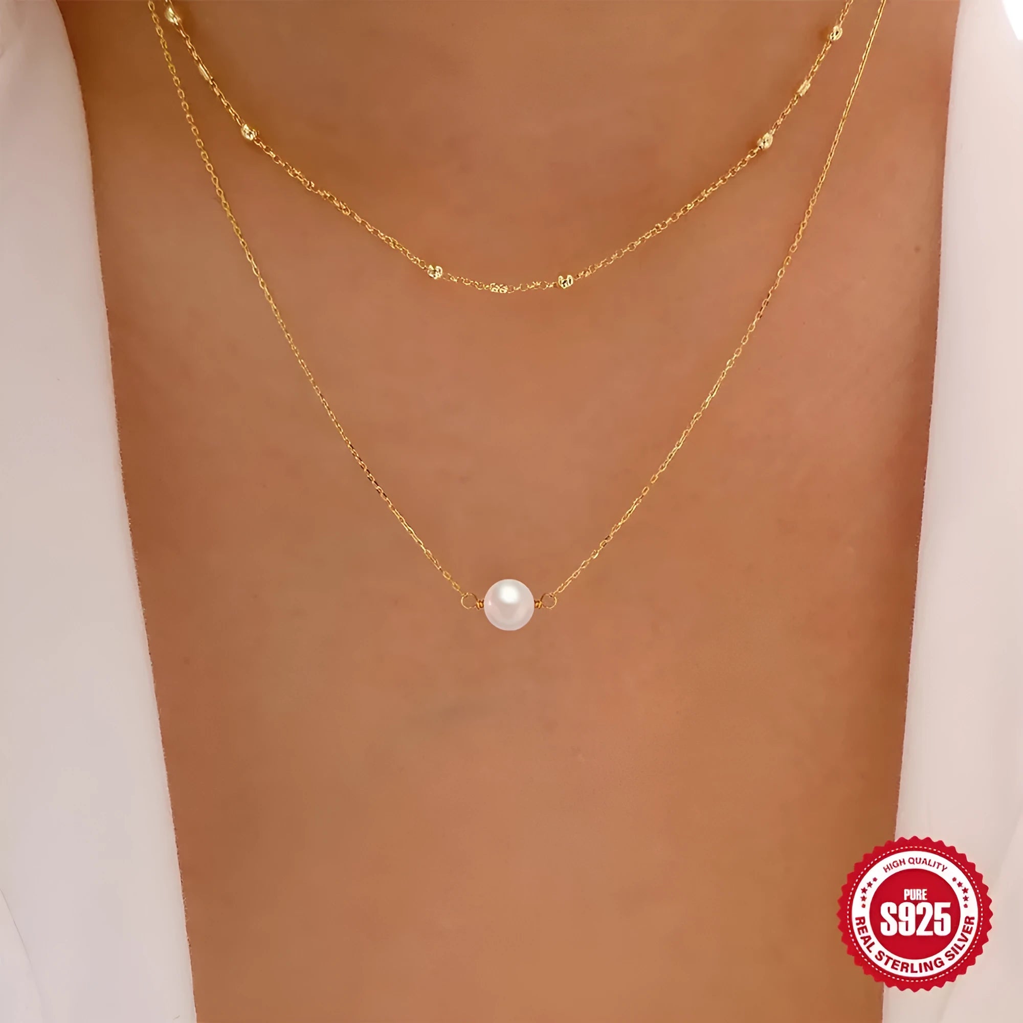 S925 Sterling silver double layer necklace with twin pearls on a ball bead chain, shown in gold and white gold colours.