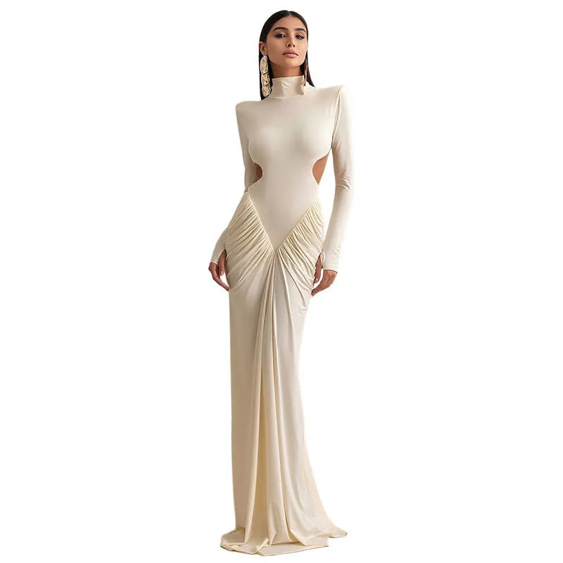 Slim fit long sleeve high collar dress with pleated backless detail in a solid colour.