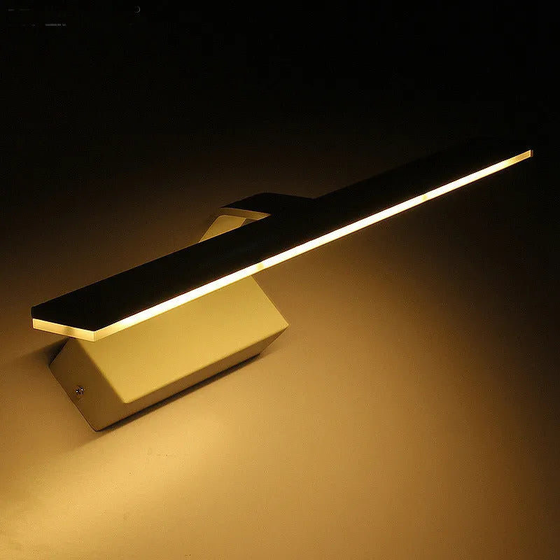 White LED bathroom mirror with tri-colour dimmable lighting mounted on a wall.
