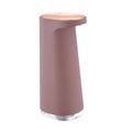 White automatic foam soap dispenser with infrared sensor on a bathroom countertop.