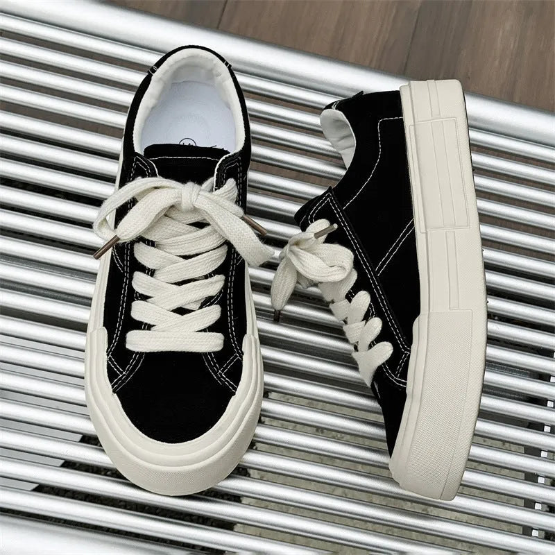 Canvas platform casual skate shoes with lace-up, tassel detail, and rubber sole in black and gray
