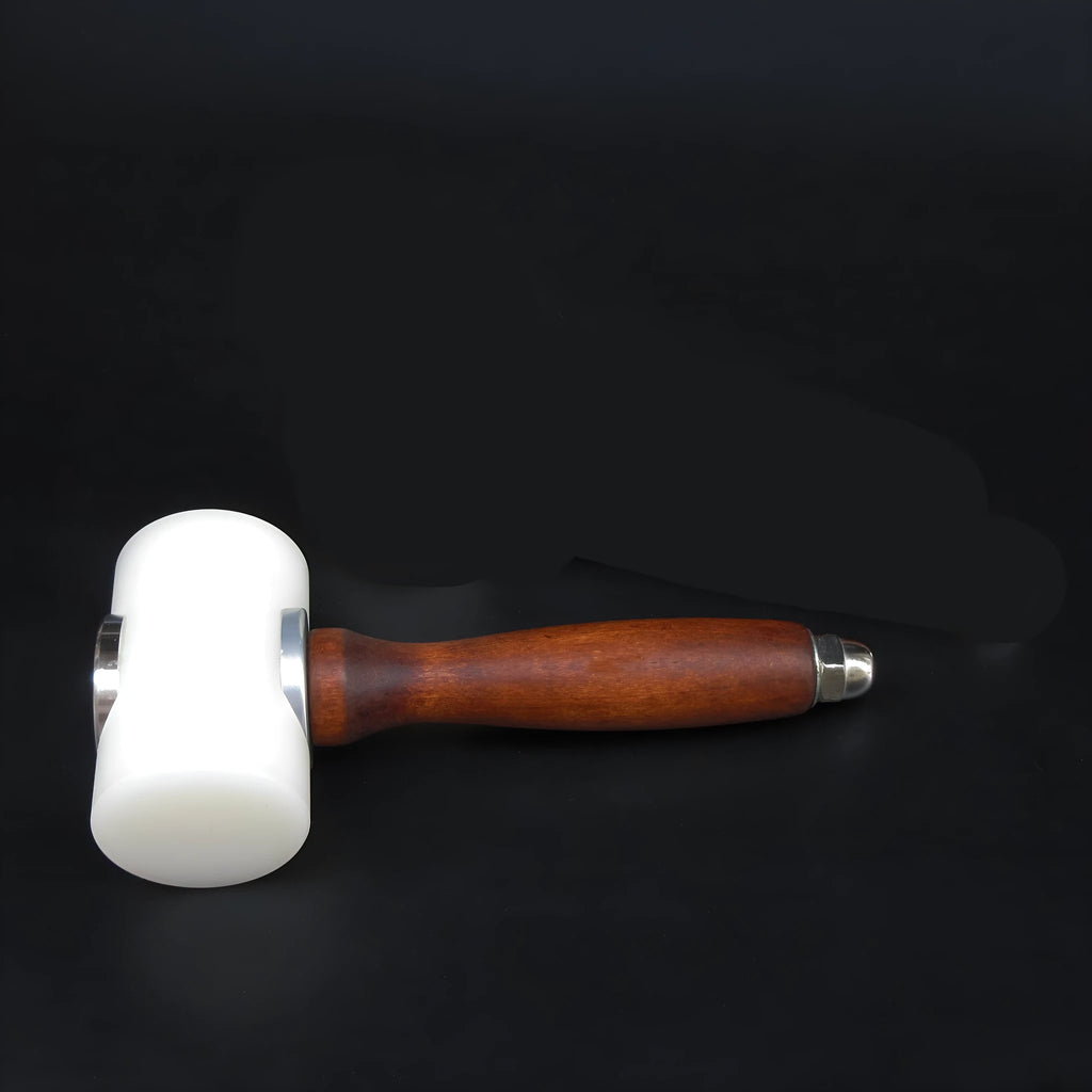 Brown handled T-shaped leather carving hammer with white nylon head for stamping and engraving