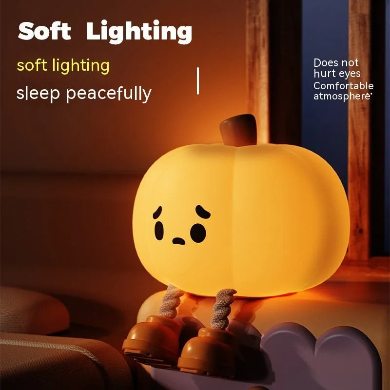 Soft silicone pumpkin-shaped night light with dimmable touch control on bedside table