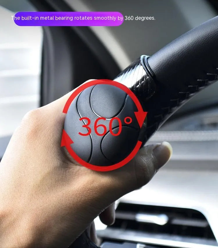 Black silicone steering wheel assist ball for single-handed driving control