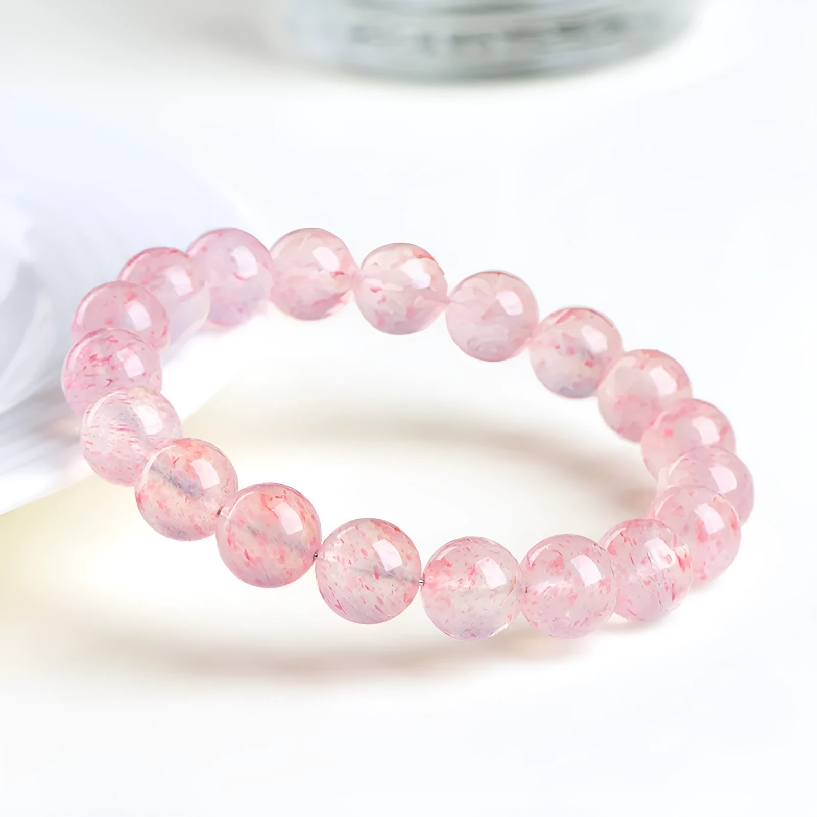 Natural white water strawberry quartz crystal bracelet with 10-10.8mm round beads.