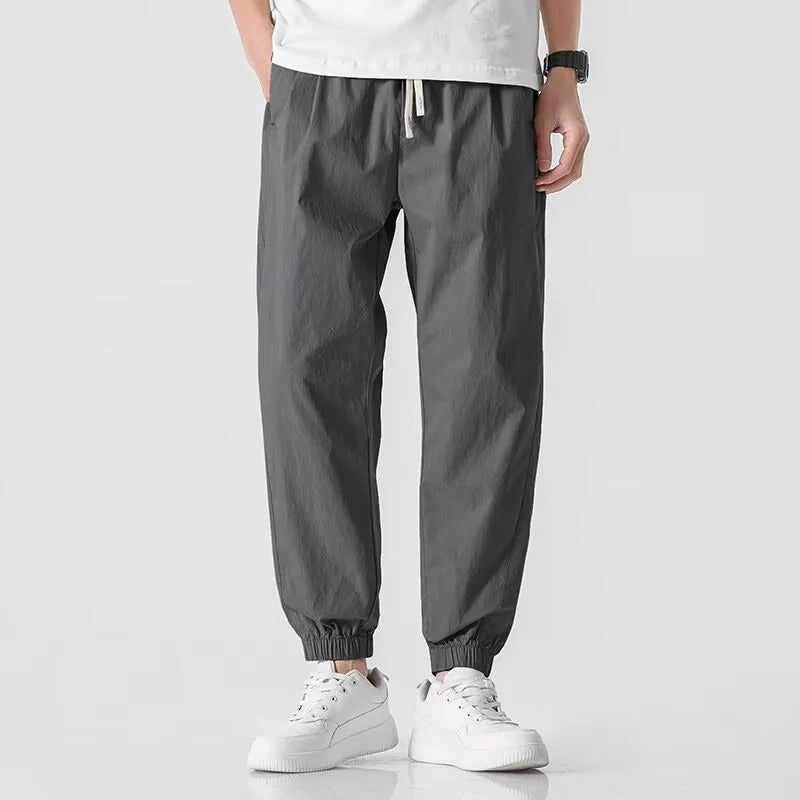 Men's fashion loose cuffed cargo pants in khaki, polyester fabric, autumn casual trousers with cuffed hem