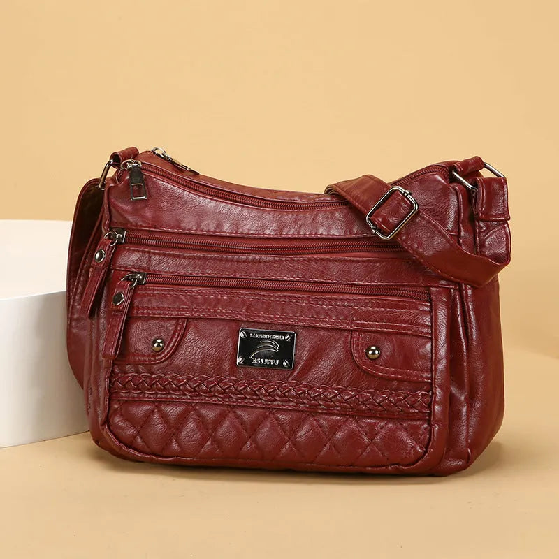 Soft PU leather shoulder bag in wine red with wash finish and outer pocket, 26x19x8cm