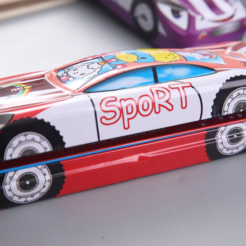 Tinplate double-layer stationery box shaped like a trolley car with a cartoon pattern