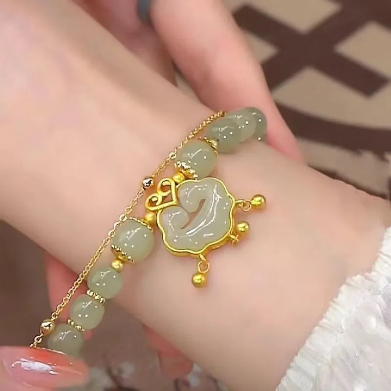 Women's green safety lock bell pendant bracelet with Xiangyun lock design on wrist