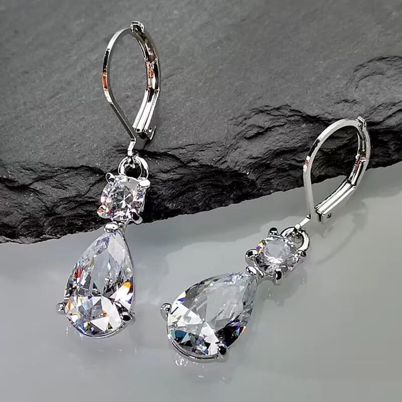 White gold drop-shaped long earrings with diamond finish on women