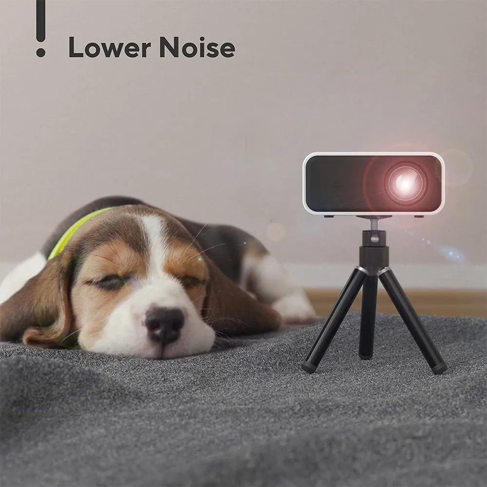 Black or white YT300 portable mini HD projector with remote control on a table.