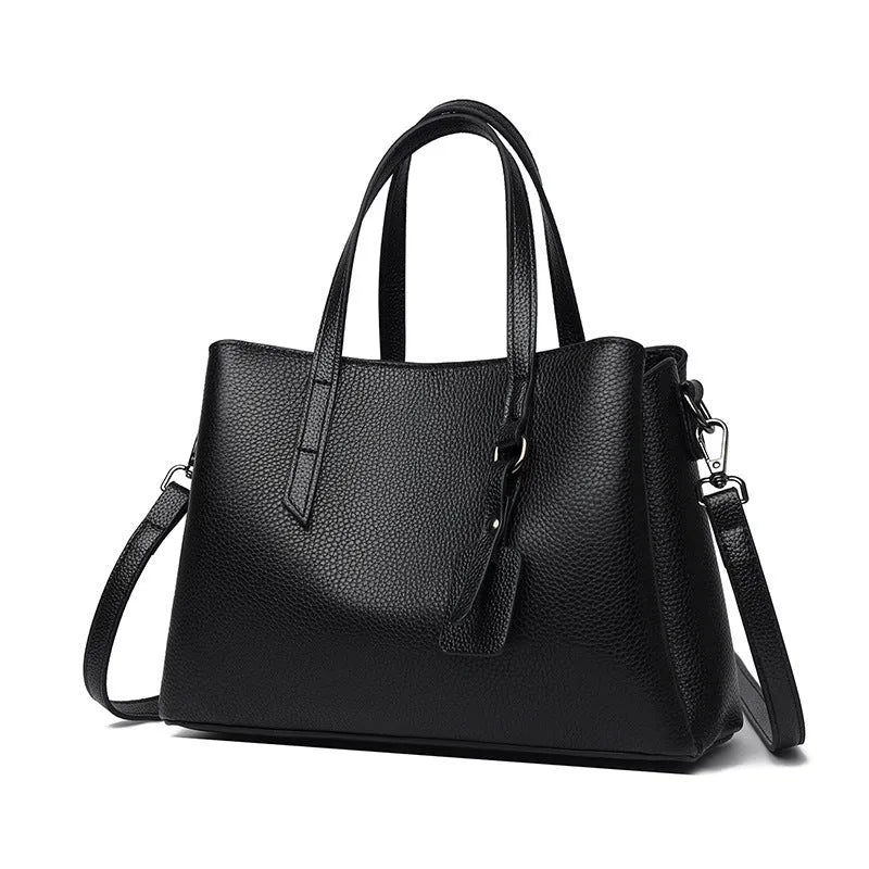 Women's cowhide leather large capacity handbag in horizontal square shape with single shoulder strap.