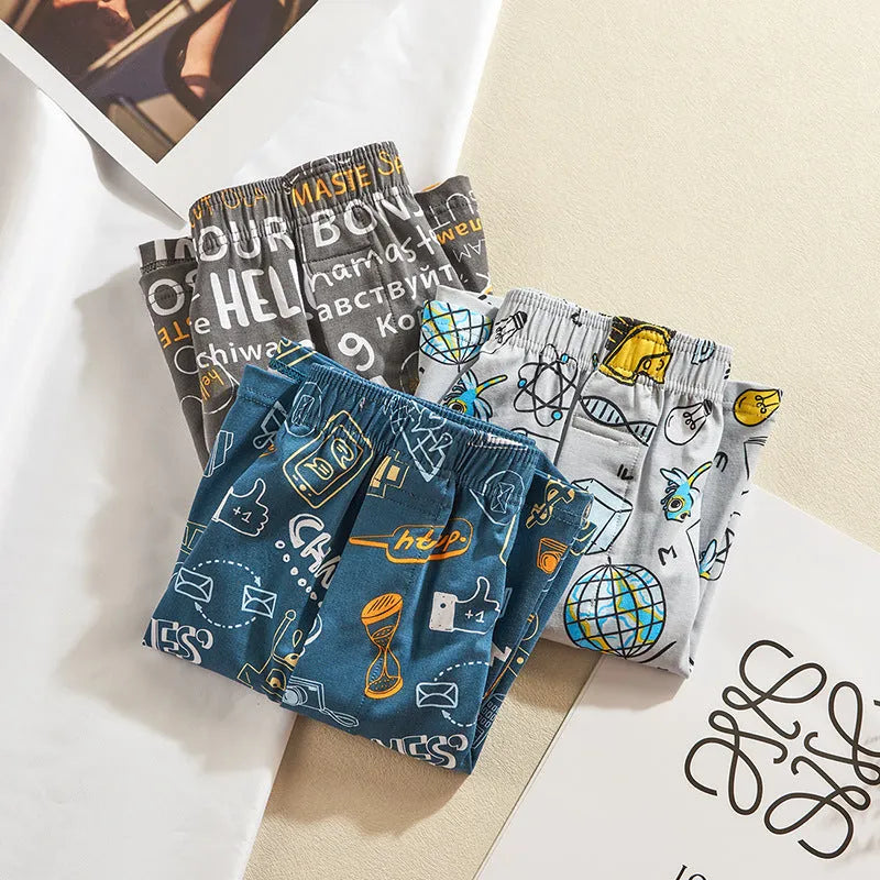 Men's cotton boxer shorts in a selection of patterns including Beast Carnival and Space Travel, showing mid-waist design.