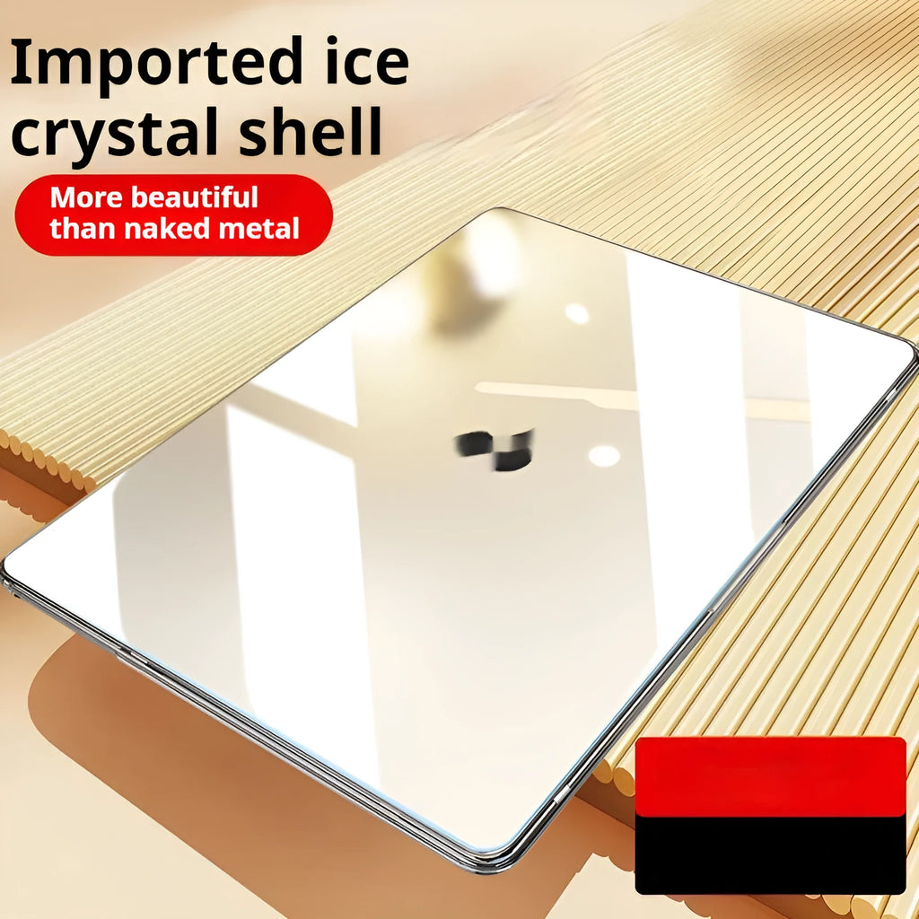 Transparent plastic protective shell case for a MacBook laptop on a table.
