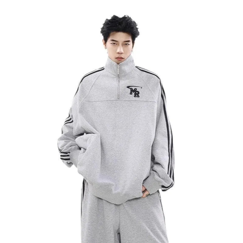 Black retro stand collar polyester hoodie coat for men and women on a hanger.