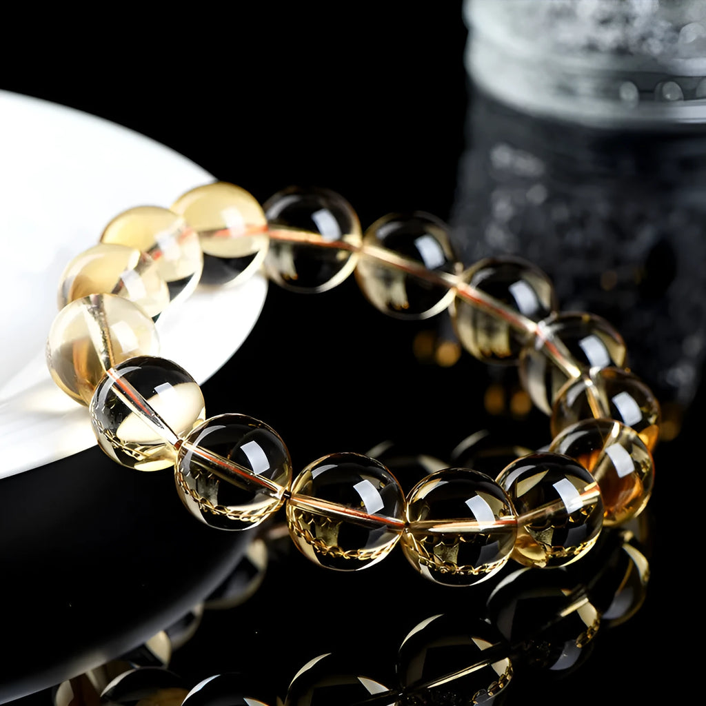 Original design natural citrine scattered beads ball bracelet showing polished yellow stones in a textured arrangement.