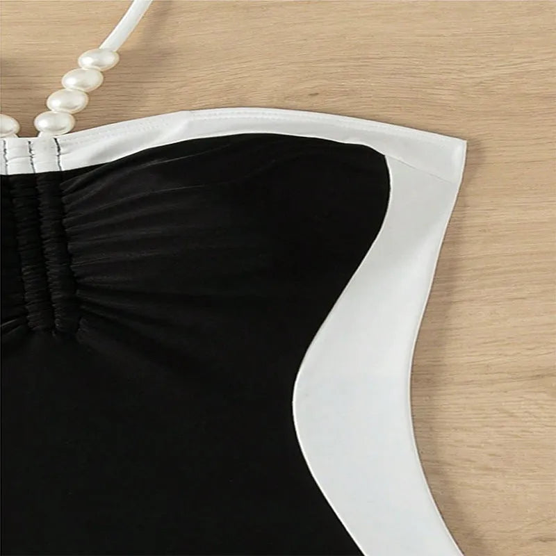 Women's black and white one-piece swimsuit with pearl spaghetti straps, slim-fitting nylon swimwear