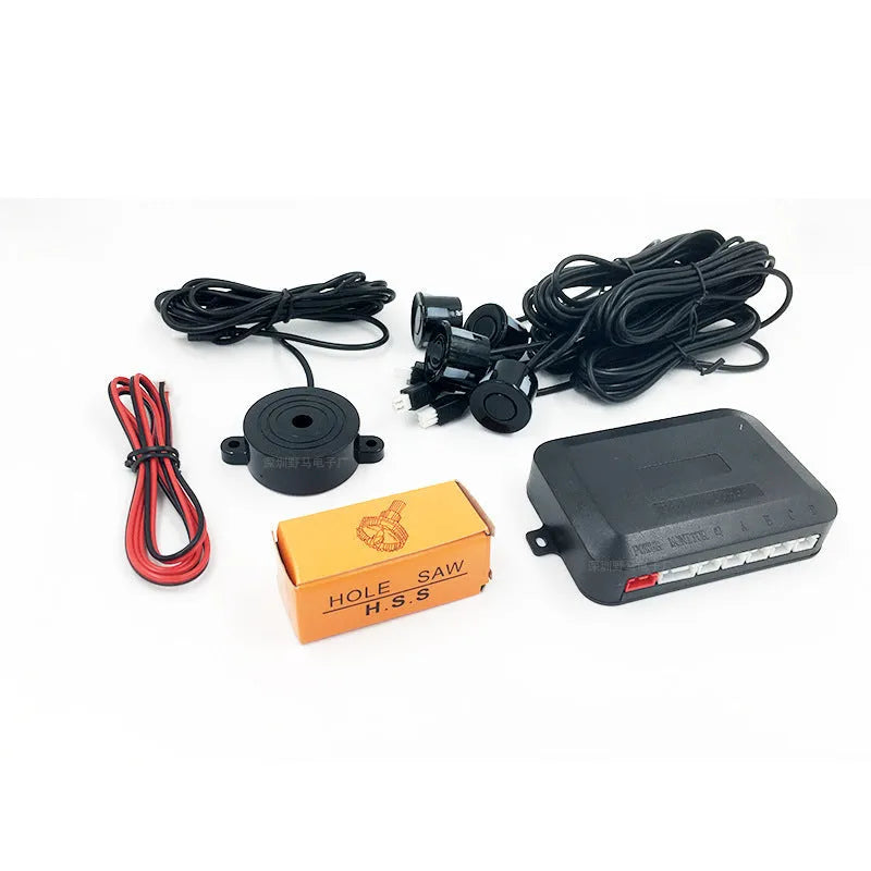 4-probe buzzer-only car reversing radar kit with sensors, control module, and hole saw on a grey background.