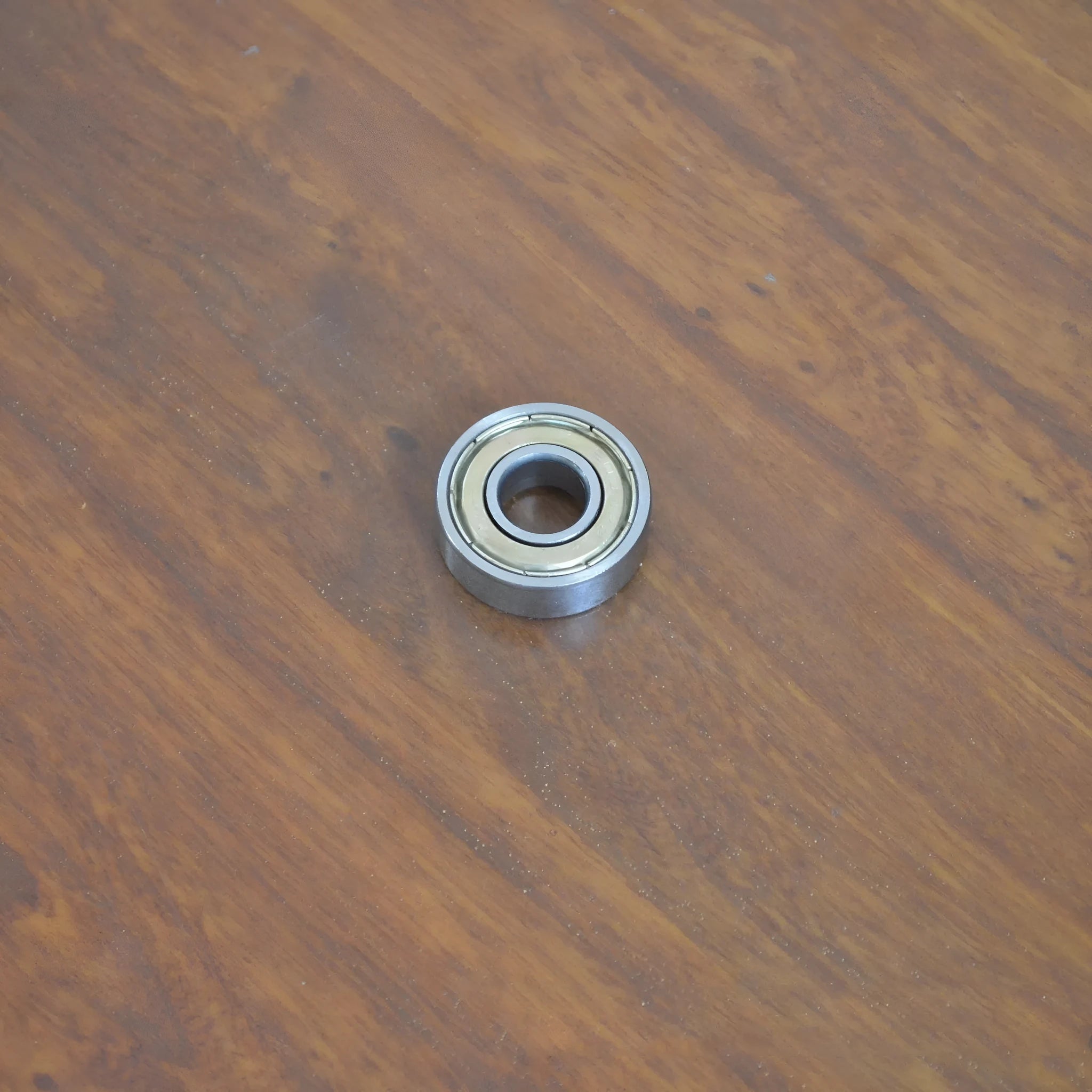 6000z carbon steel ball bearing showing 10mm inner diameter and 26mm outer diameter measurements