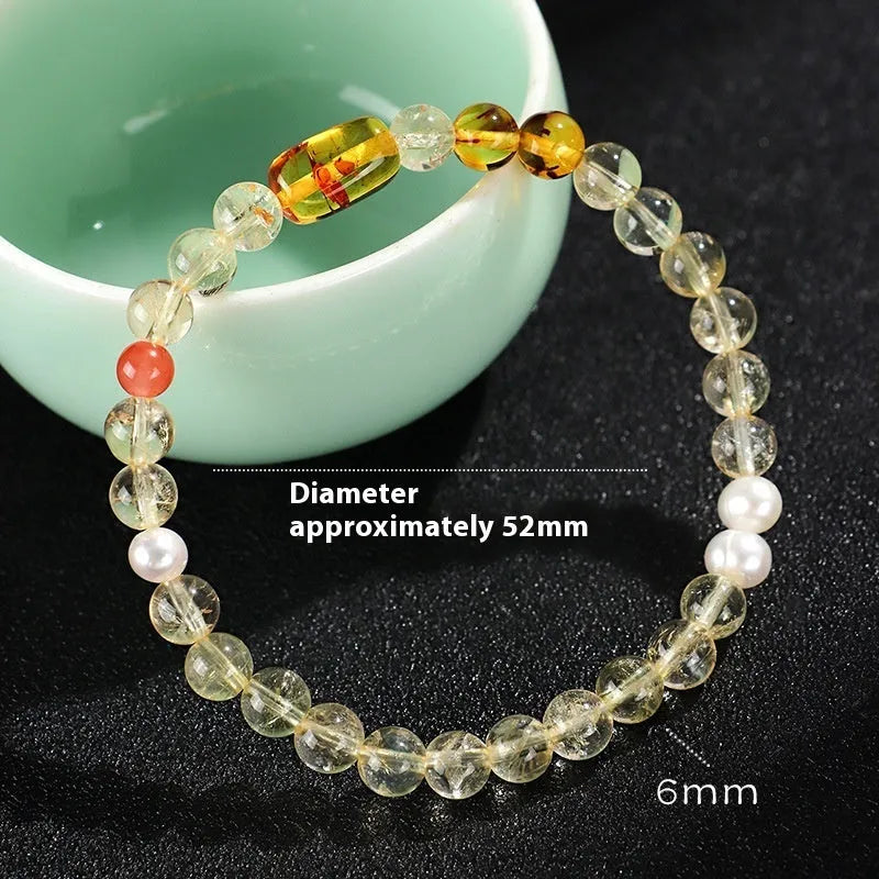 Handmade Huang Tajing beaded bracelet with freshwater pearl, yellow crystal, and white crystal beads