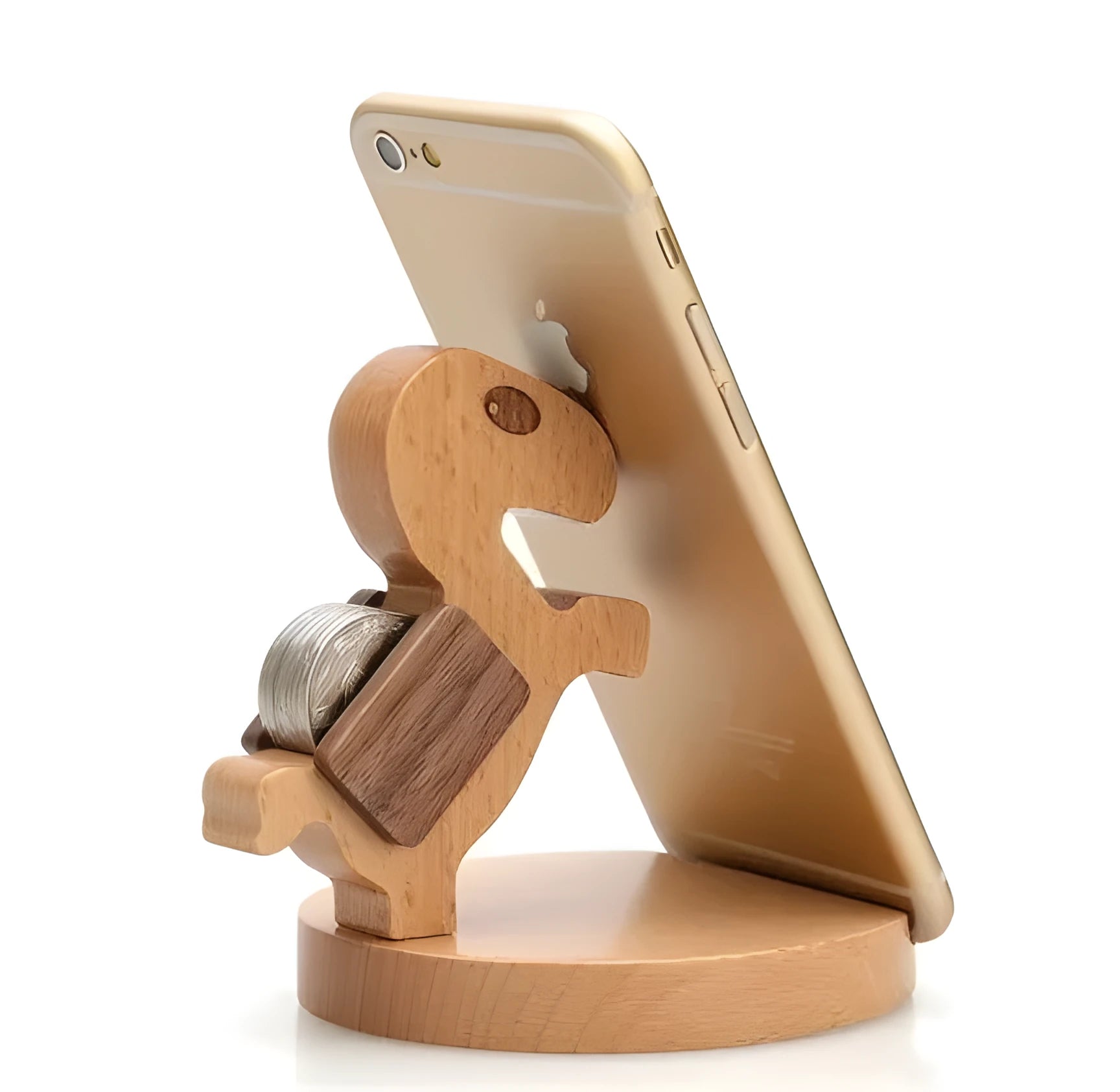 Sculpted beech wood lazy bracket phone holder with custom engraved text on a wooden desk.