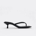 Khaki women's mid-heel sandals with a round toe and flip-toe design on a rubber sole.