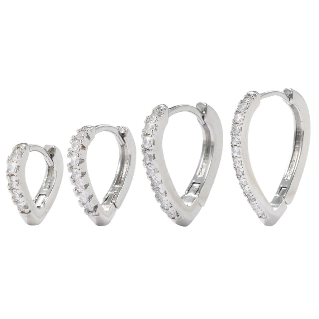 A geometric heart-shaped ear clip for women in electroplated copper, shown in gold and white K colour options.