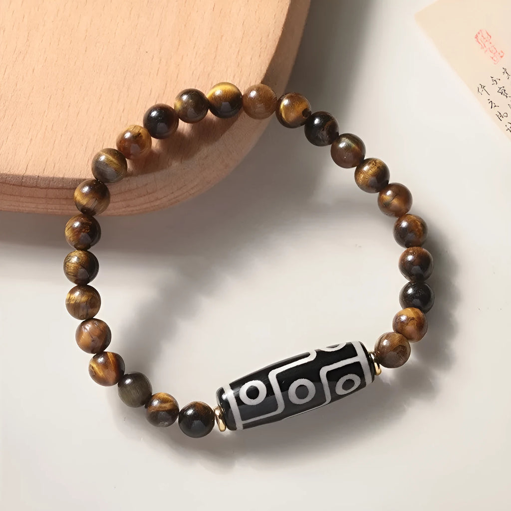 Simple single-circle Tigereye Dzi bead rosary bracelet showing the banded stone, available in multiple bead sizes.