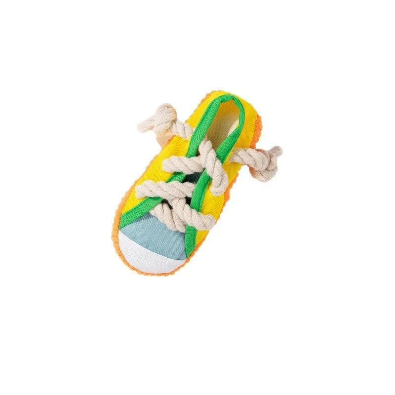 Slipper-shaped plastic dog chew toy with a squeaker, shown in yellow, black, and blue colour options.