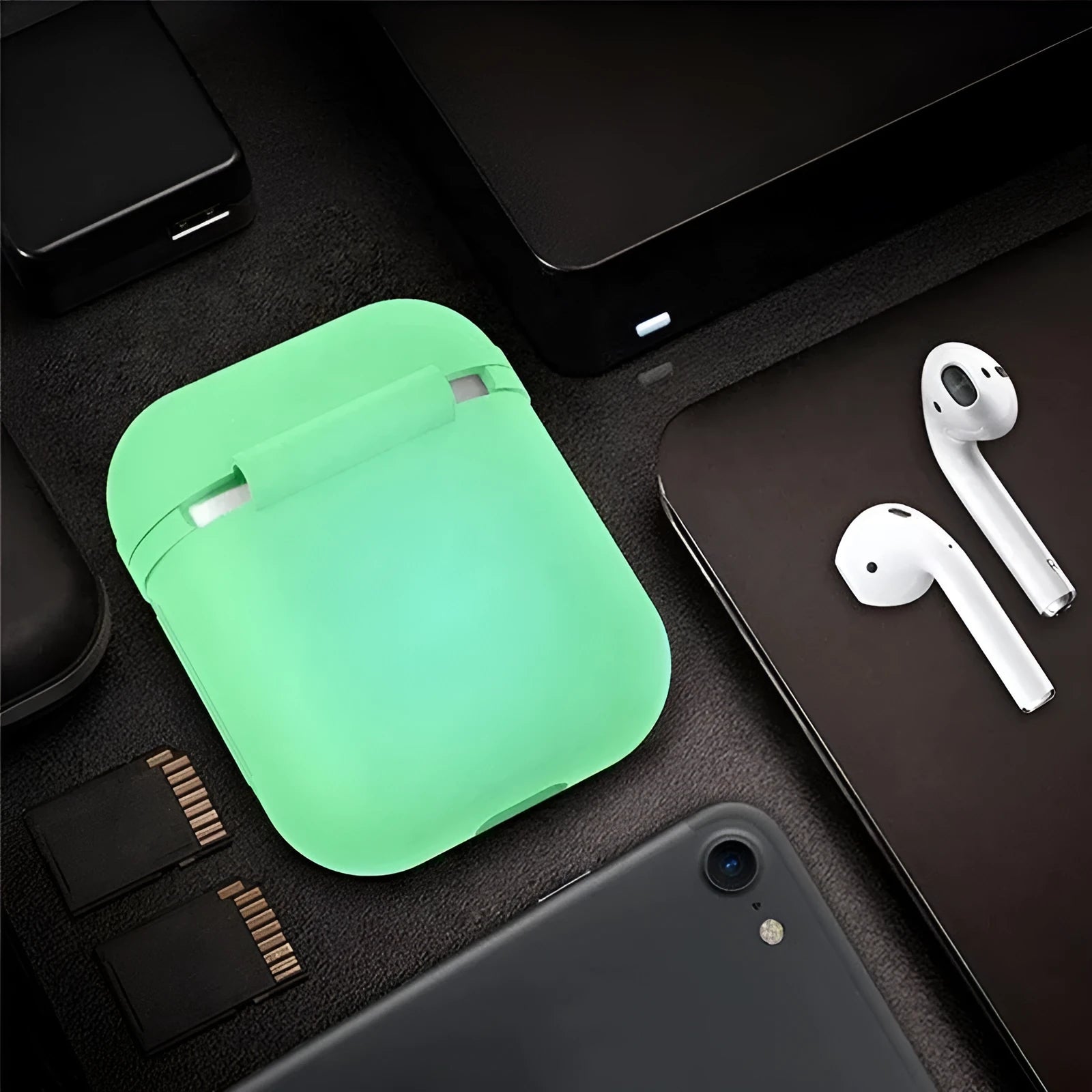Luminous blue silicone flip-open protective case for Apple AirPods charging case on a dark background.