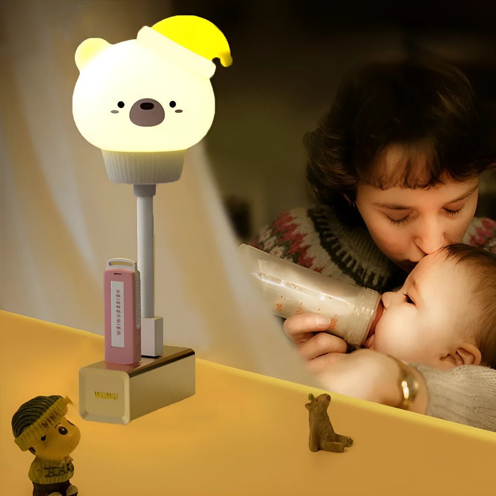 White USB cartoon animal night light in bear design with remote control on wooden table.