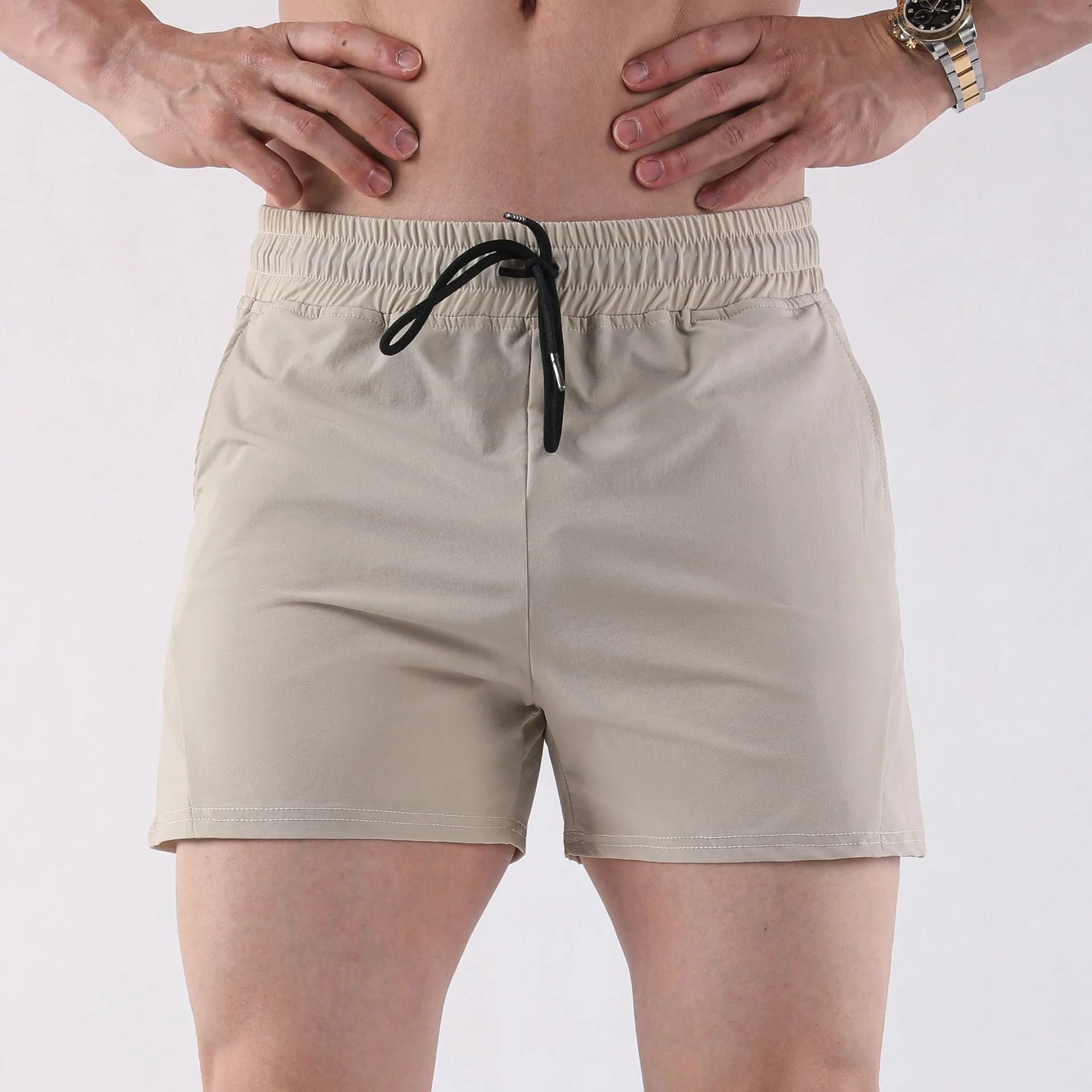 Men's grey polyester basketball shorts with an elastic waistband, laid flat.