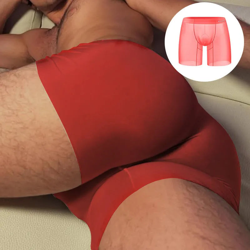 Men's seamless nylon boxer shorts in orange, low waist design, laid flat.