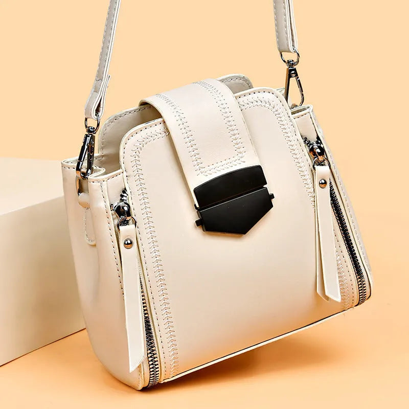 Soft textured PU leather small square handbag for women in multiple colour options showing sewing thread detail.