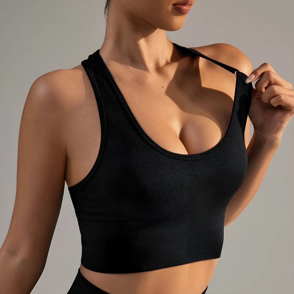 Black women's sports bra with moulded cups and double-shoulder straps for running and yoga