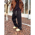 Men's casual sweatpants in black cotton loose fit with elastic waist and mid rise side view